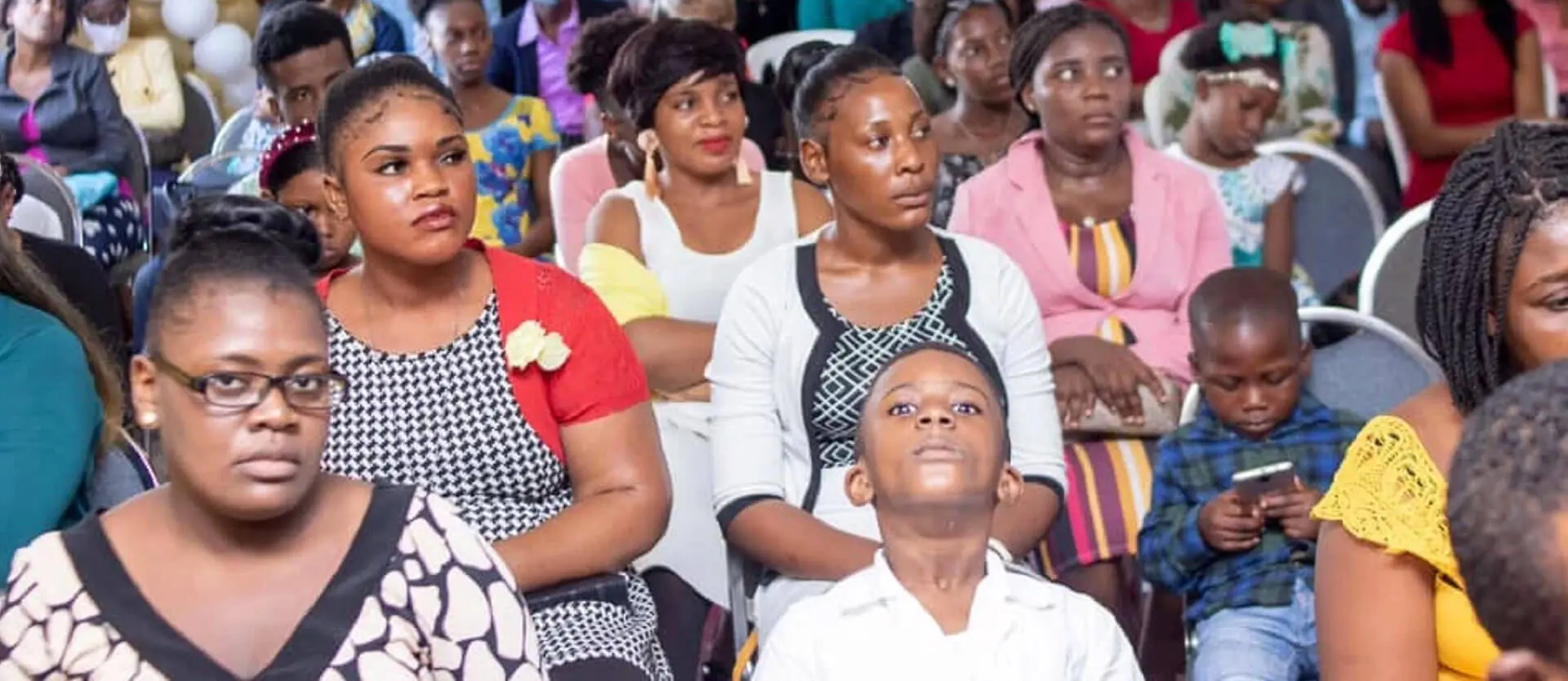 African People sitting of chair in an program